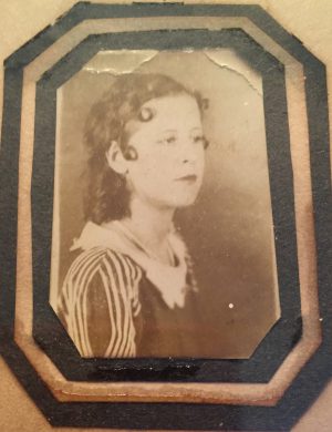 A young woman dressed for the photographer.